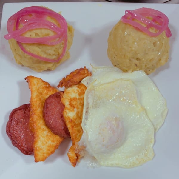 BLT's Breakfast Lunch & Takeout's breakfast dish with two mounds of mangu, fried cheese, salami, and fried eggs.